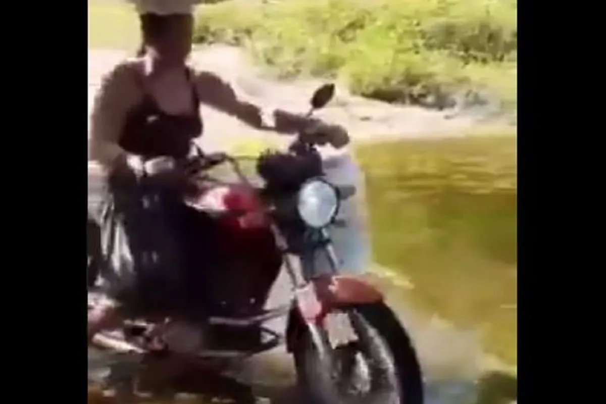 Woman Rides Bike On Water