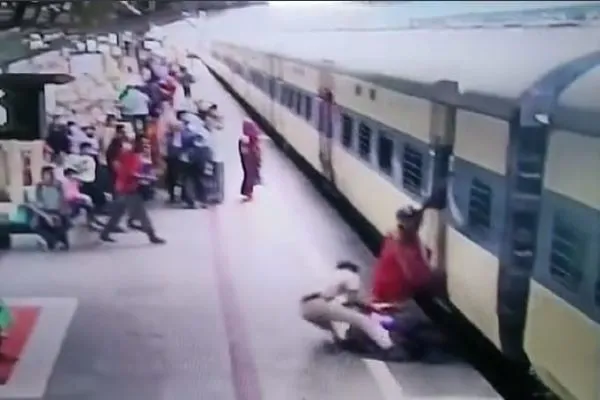 railway cop drags woman from gap